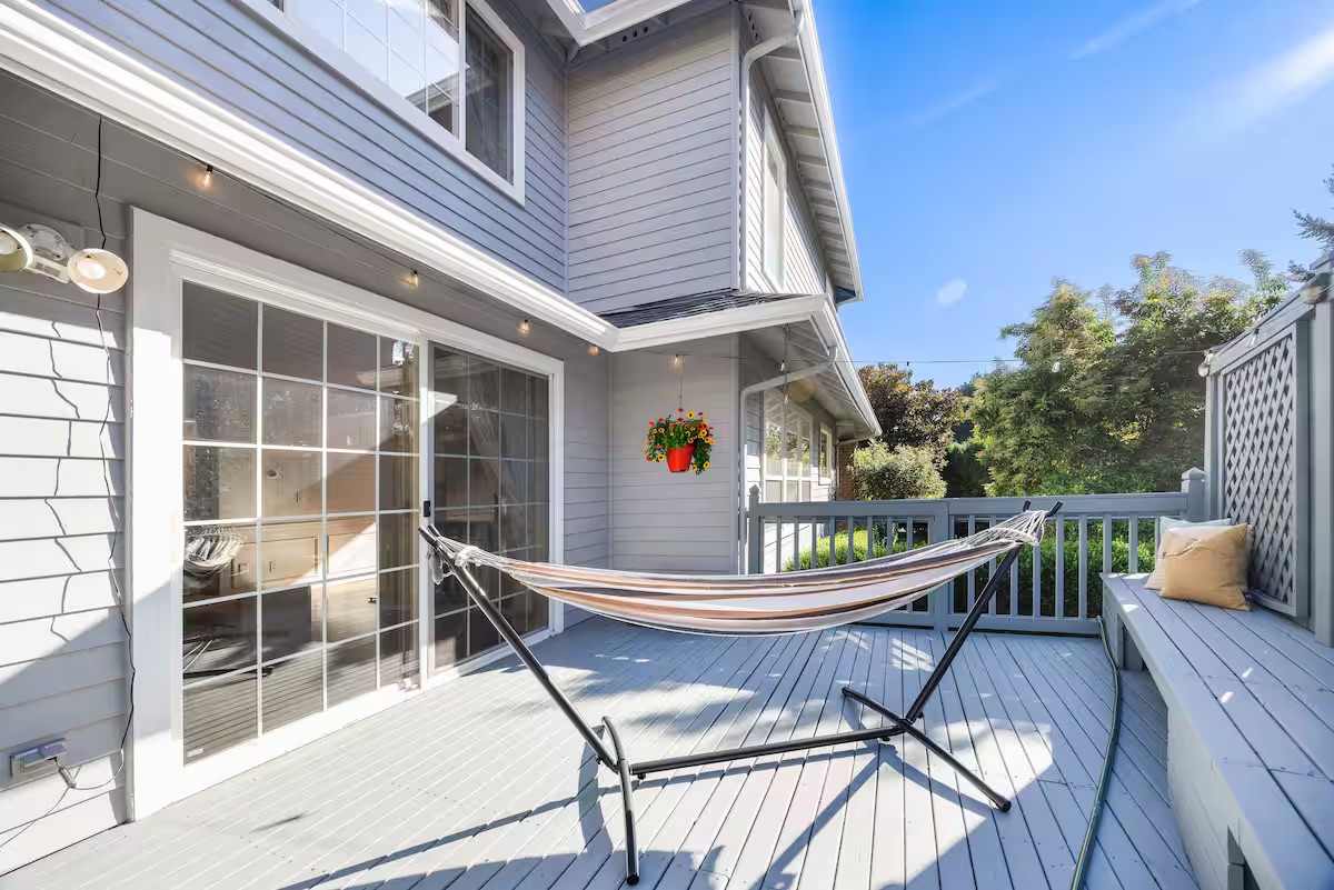 A hammock and seating on the covered deck of the Kirkland home.