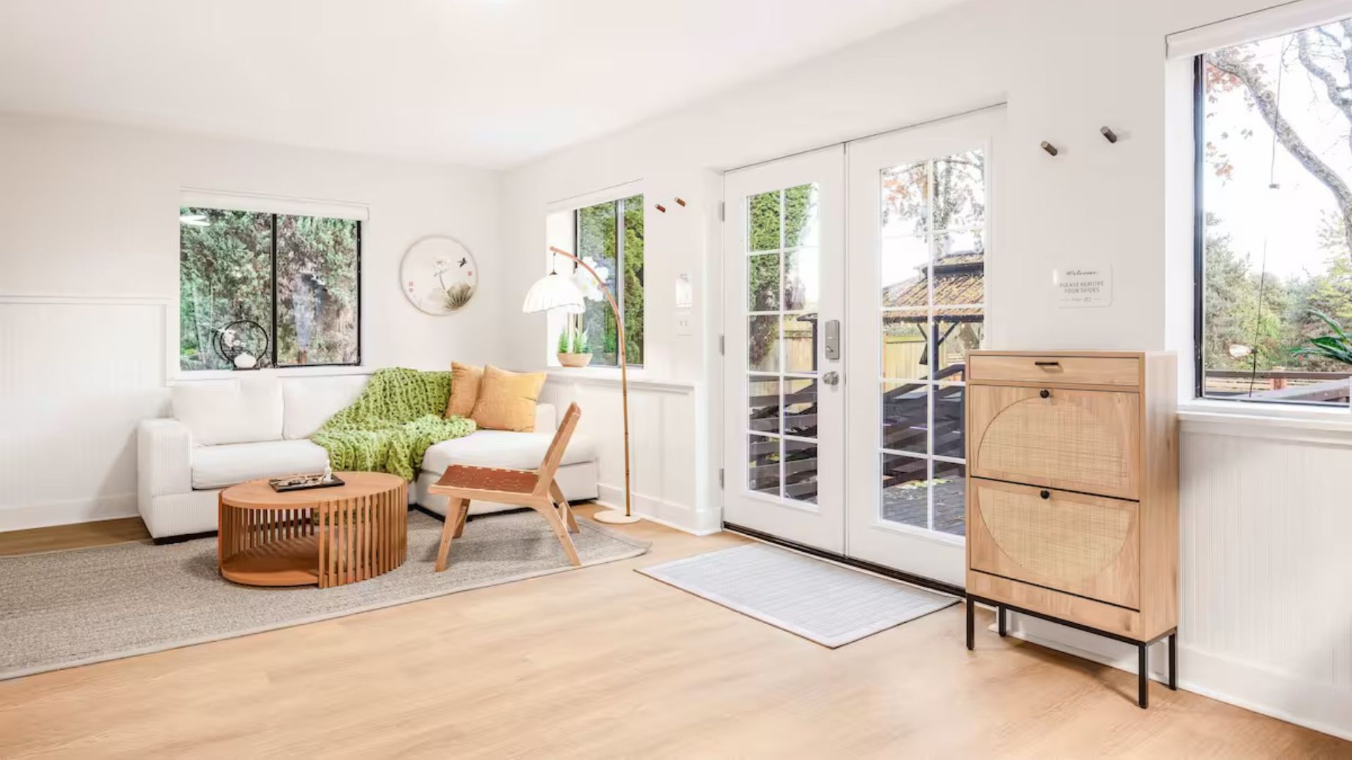 Natural wood, a simple sofa and restrained colors in the Seattle retreat living room.